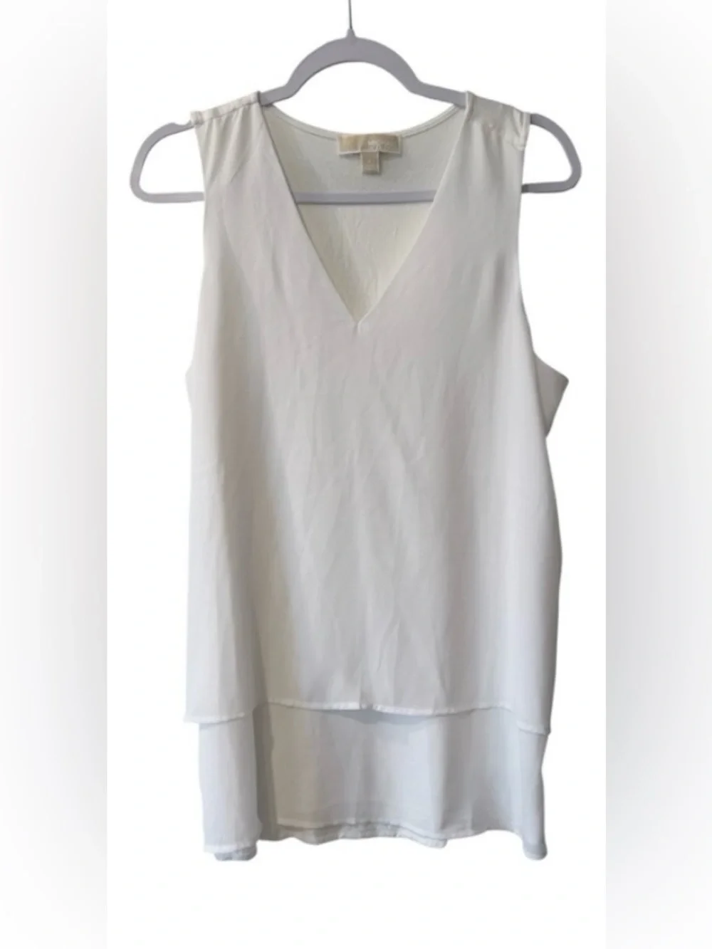Michael Kors women’s Large sleeveless V-neck blouse with an asymmetrical hem